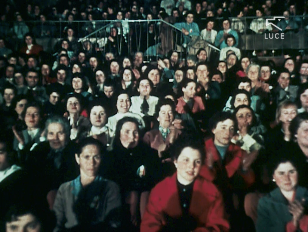 Vintage photograph of a crowd of women sitting on chairs.