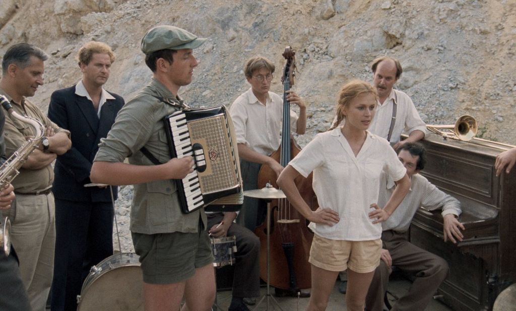 Photo of a group of musicians playing instruments.